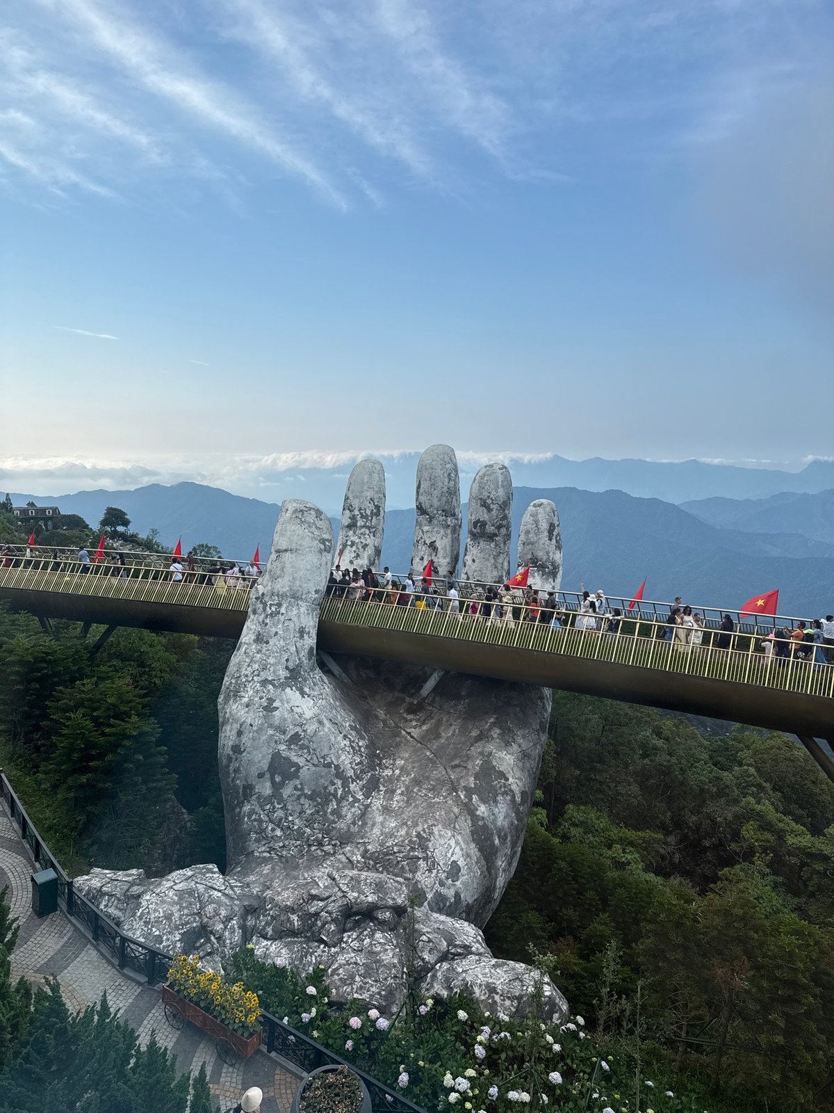 Tourists document morning visit to Golden Bridge in Vietnam