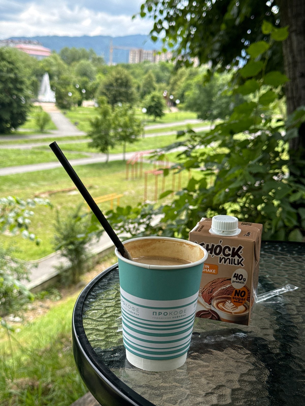 Coffee and protein milk on a glass table in Vladikavkaz