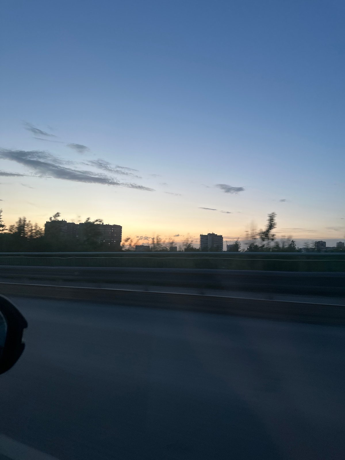 Evening drive captured on Perm highway during twilight