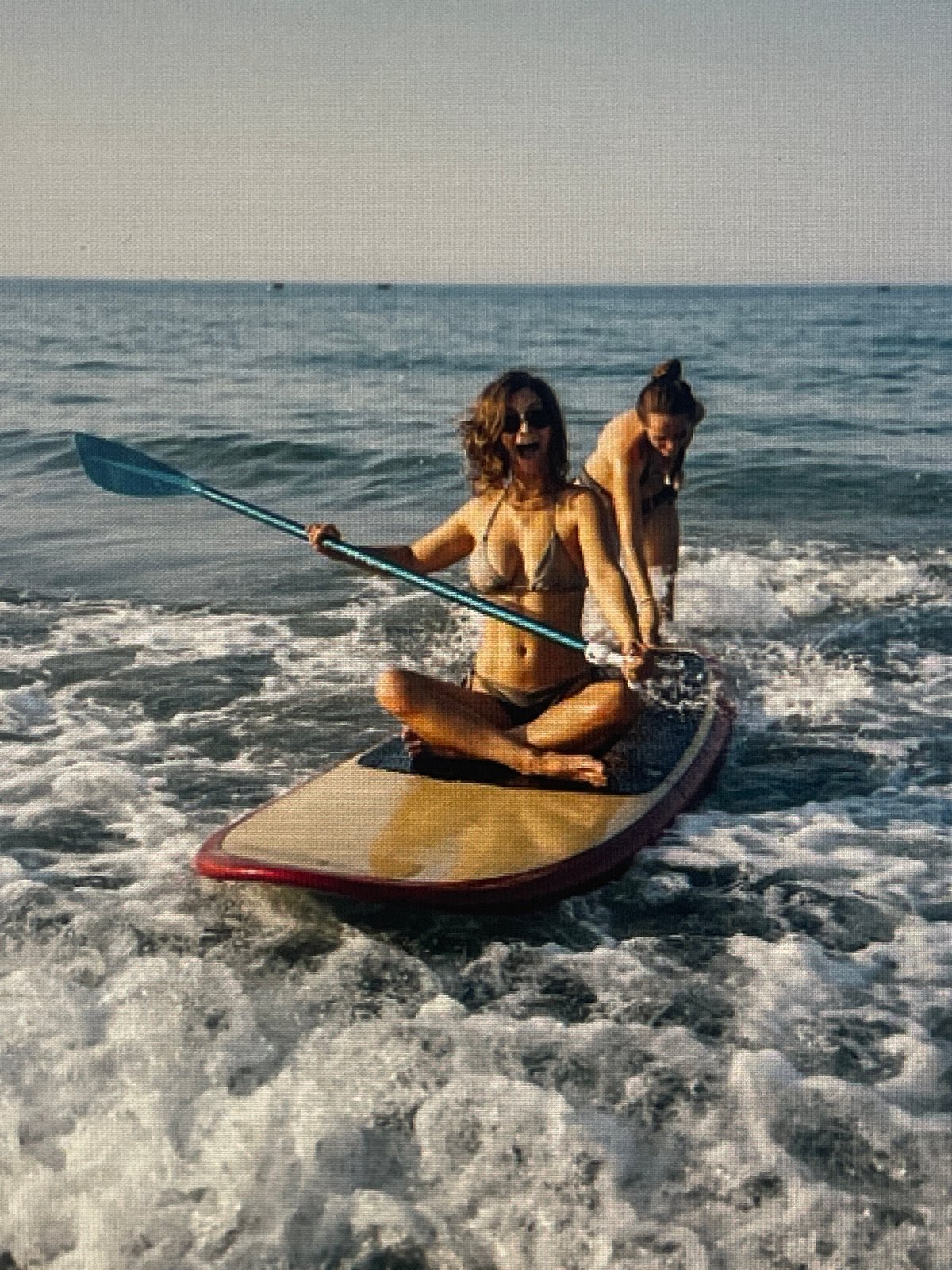 Beach day mix: paddleboarding, sunbathing, and a few odd ones out