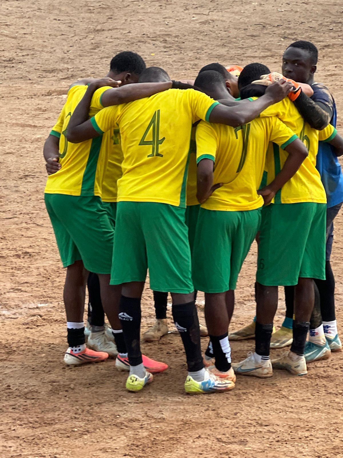 Football in full swing on a dusty pitch in Jos, Nigeria.