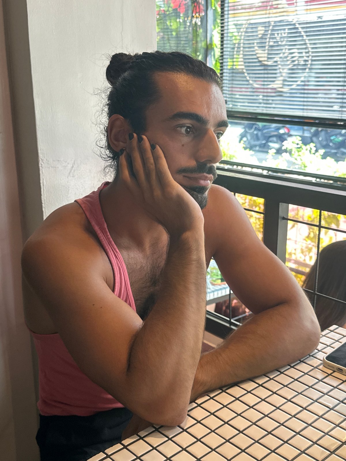 Brunch at a Bali café with food, friends, and a fluffy dog