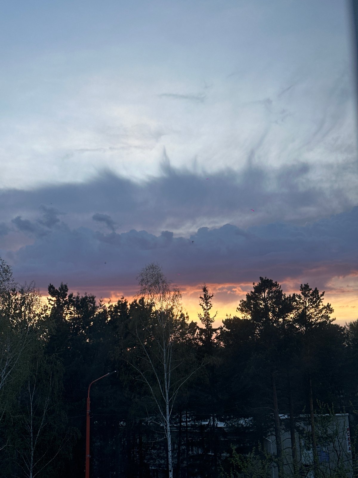 Cloudy skies photographed over Sayansk, Russia during afternoon hours