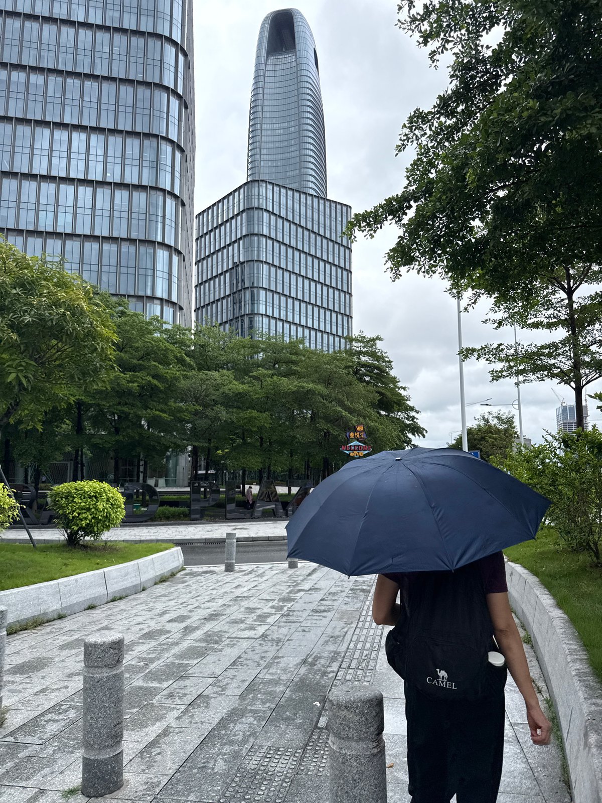 Wet streets and glass towers in Haizhu District after morning rain