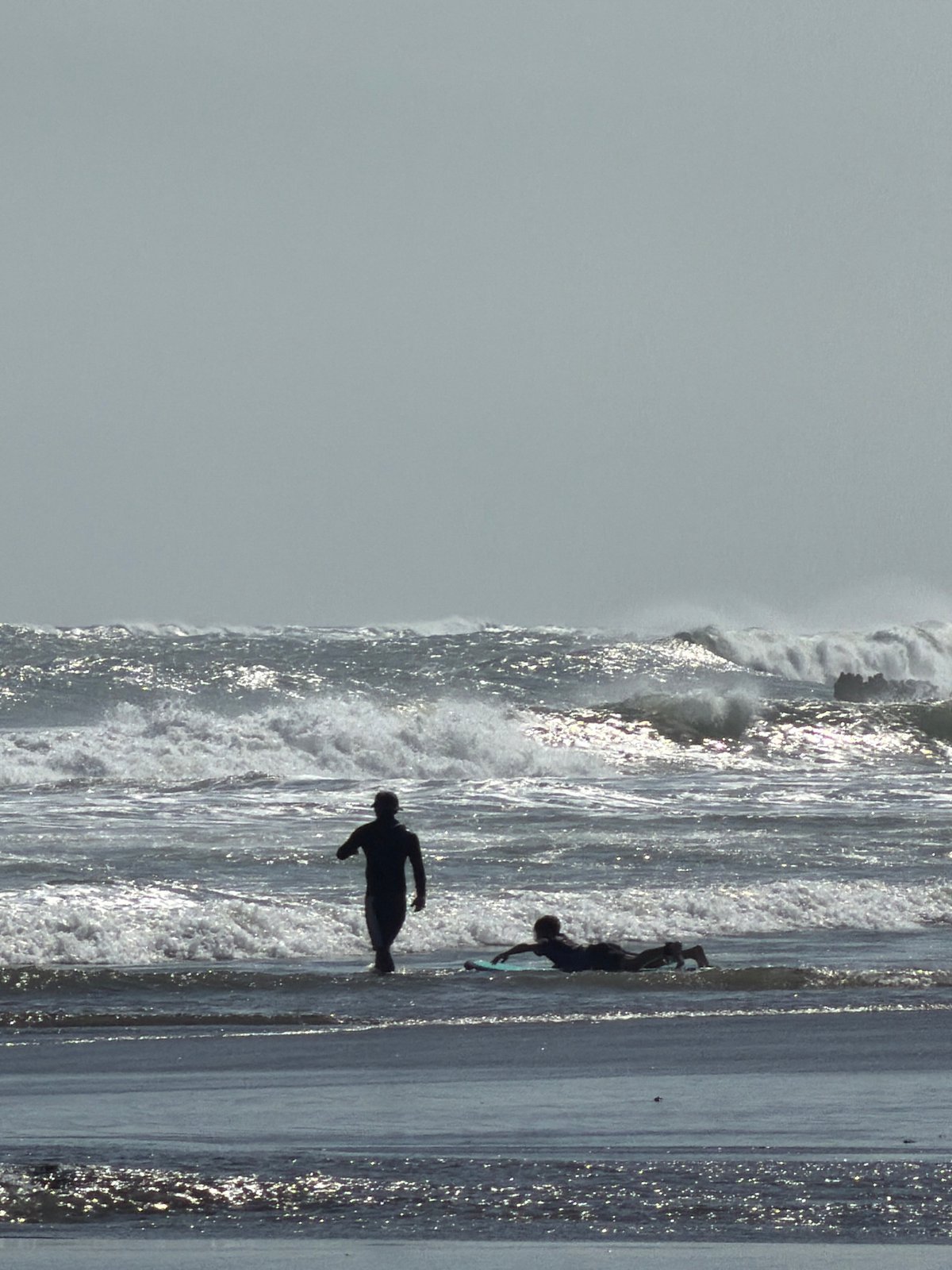 Morning beach activity along Bali's North Kuta shoreline
