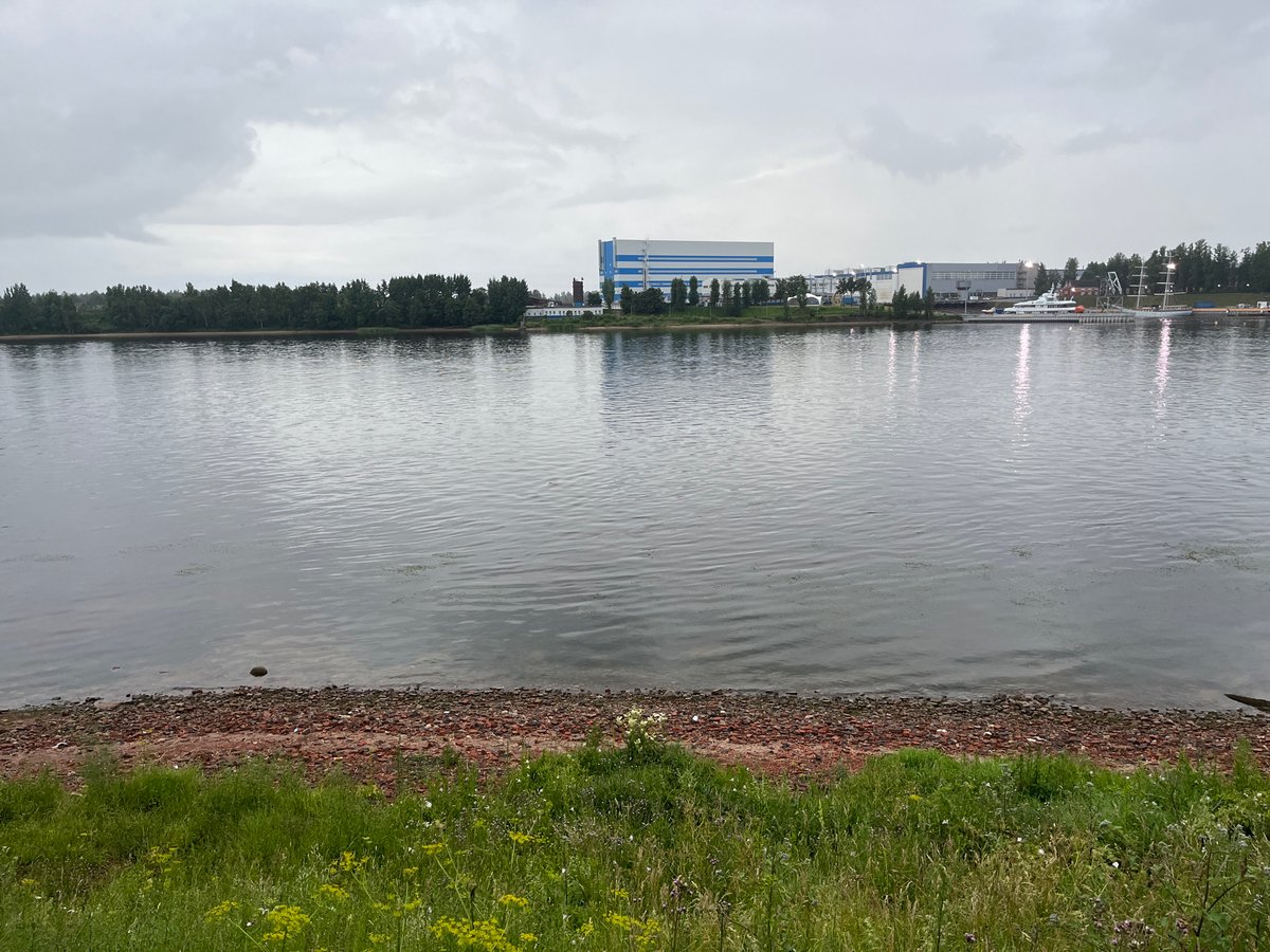 Overcast afternoon at the Neva River near an industrial shipyard