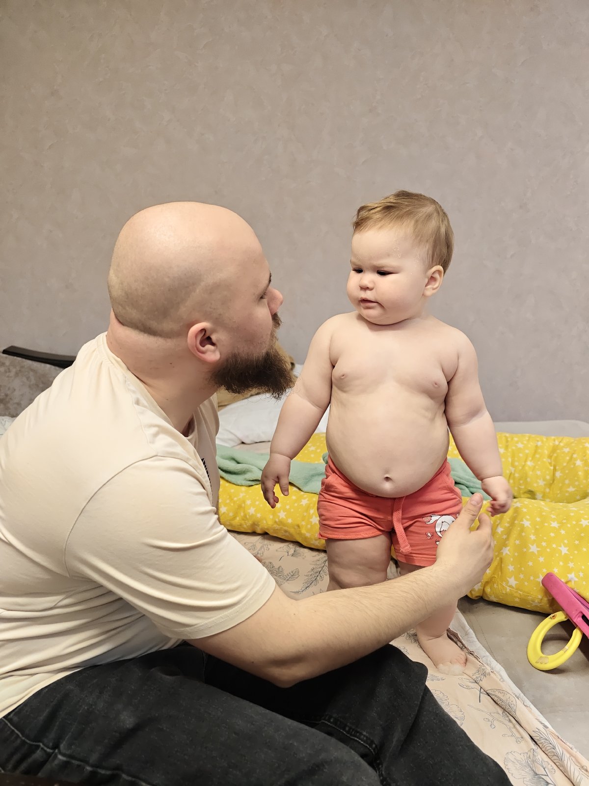 Father and baby share morning moments in Chaikovsky bedroom