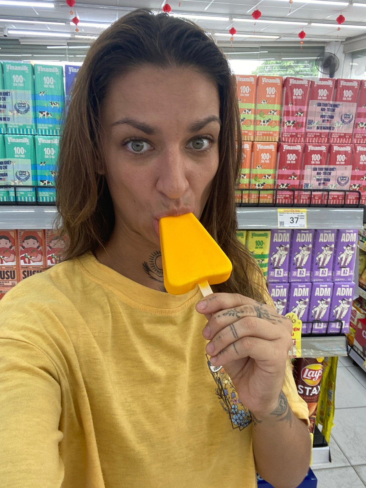 Woman samples frozen treats while shopping in Đồng Nai stores