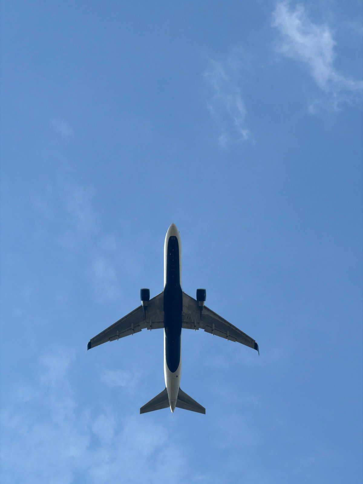Commercial jet climbs low overhead near Prague, landing gear still down