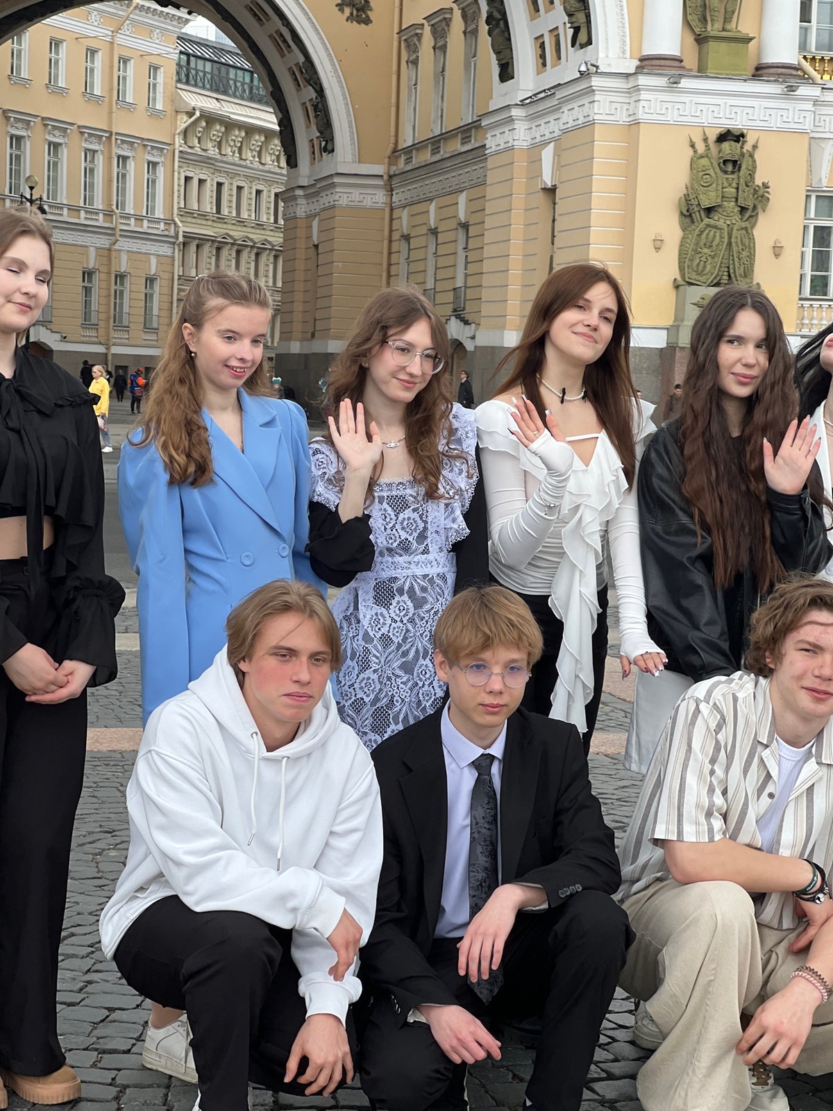 Young people pose at Palace Square, Saint Petersburg