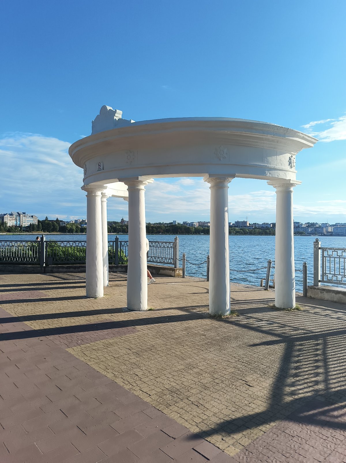 Sunny afternoon along Ternopil Pond's promenade and parkways