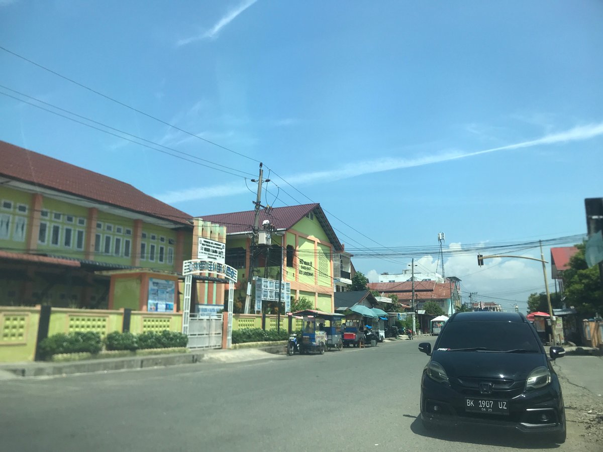 Morning street life and coffee culture in Lhokseumawe, Indonesia