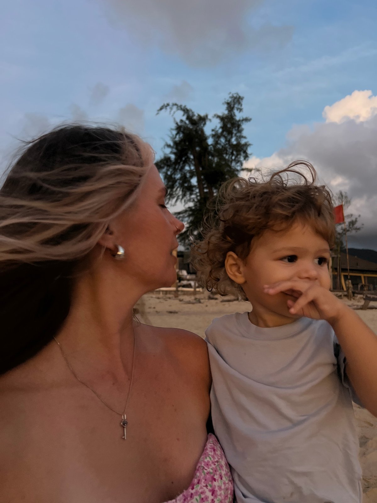 Beach hangout with dramatic skies and family moments at dusk