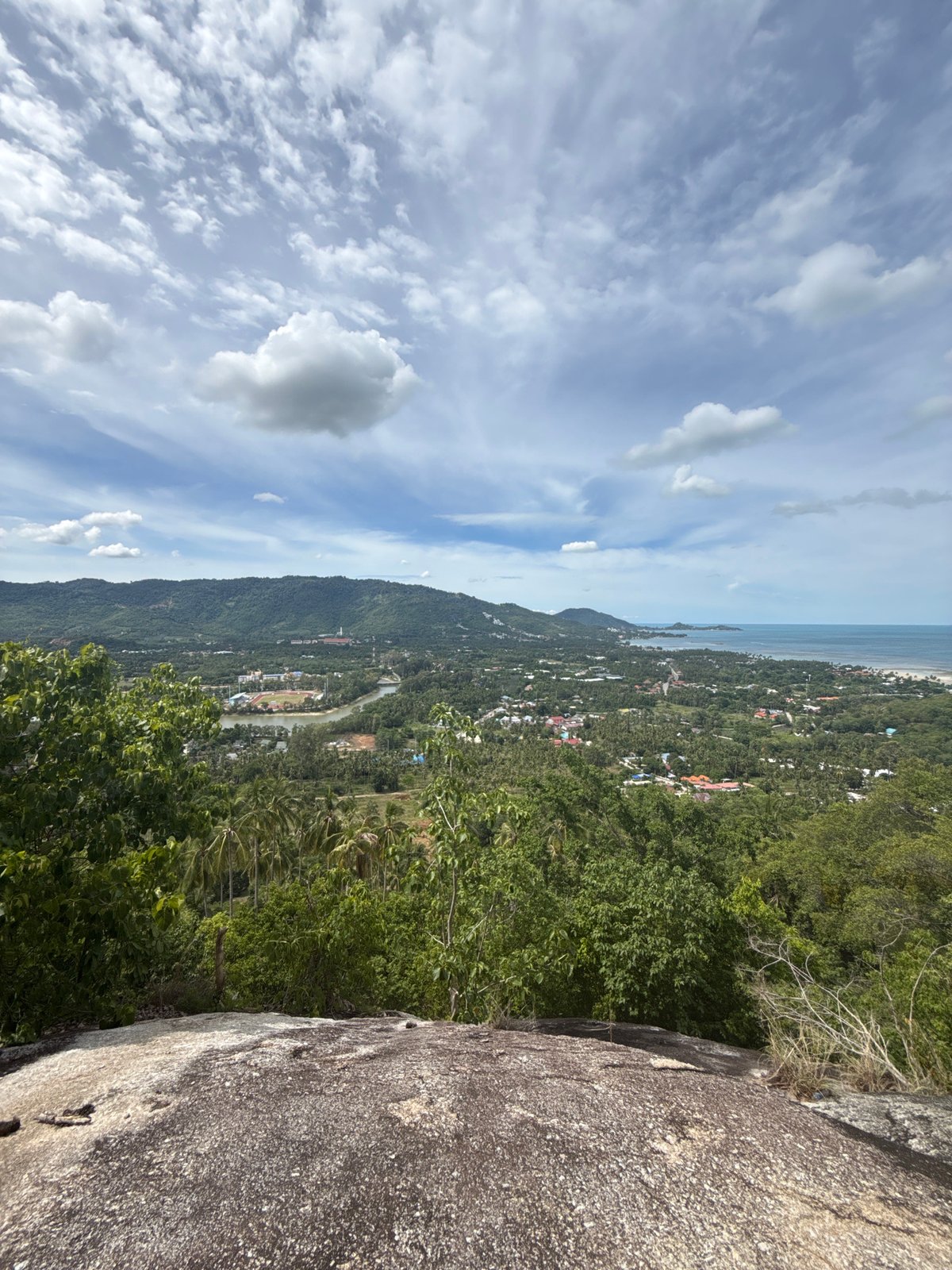 Hilltop views and rocky details above Baan Harn's coastline
