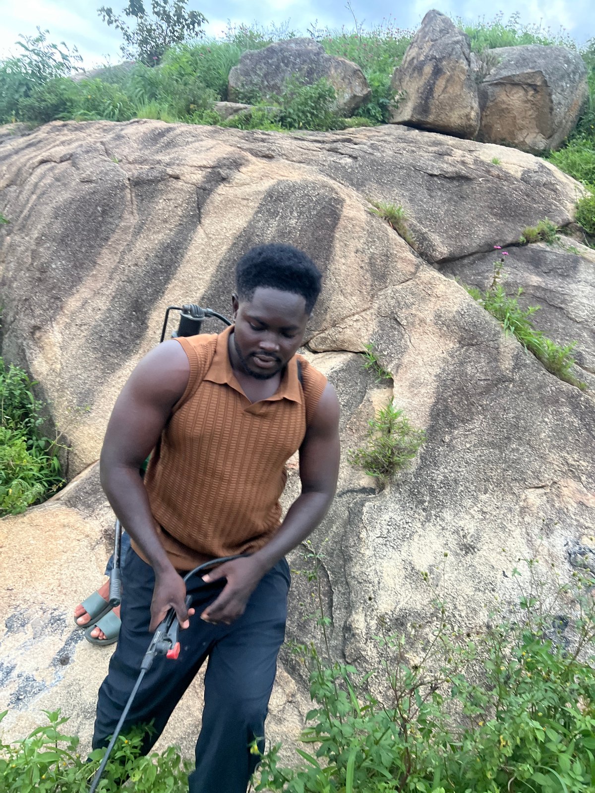 Vegetation spraying on a rocky hillside in Jos, Nigeria