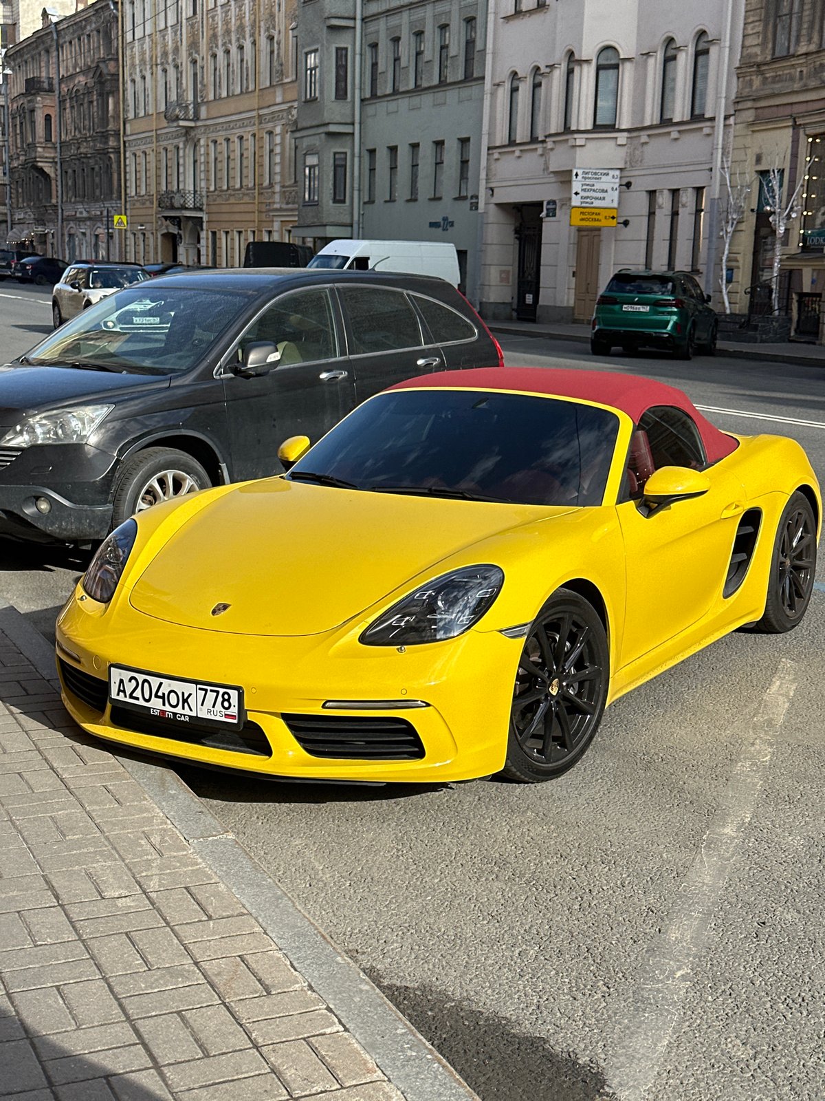 Yellow Porsche convertible spotted parked in Saint Petersburg street