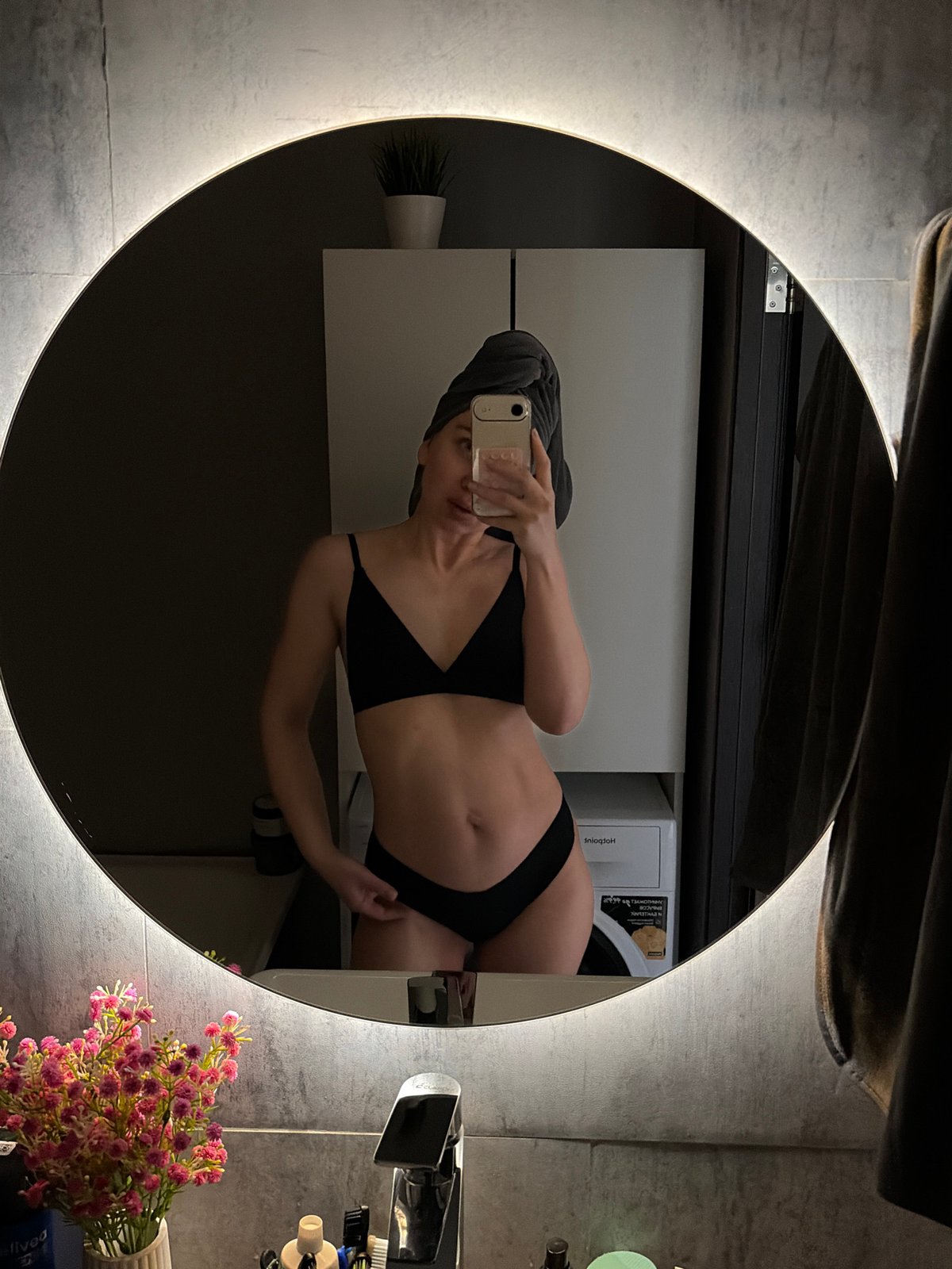 Woman takes bathroom mirror selfies in Chaikovsky, Russia