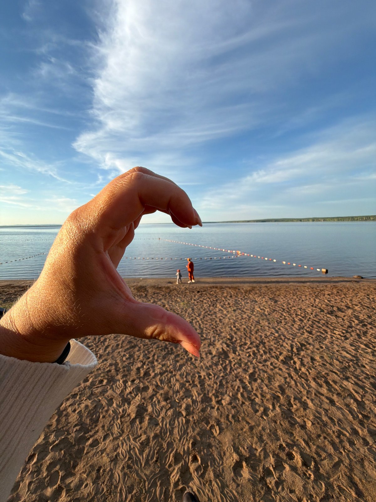Golden hour beach scene captured in Chaikovsky, Russia