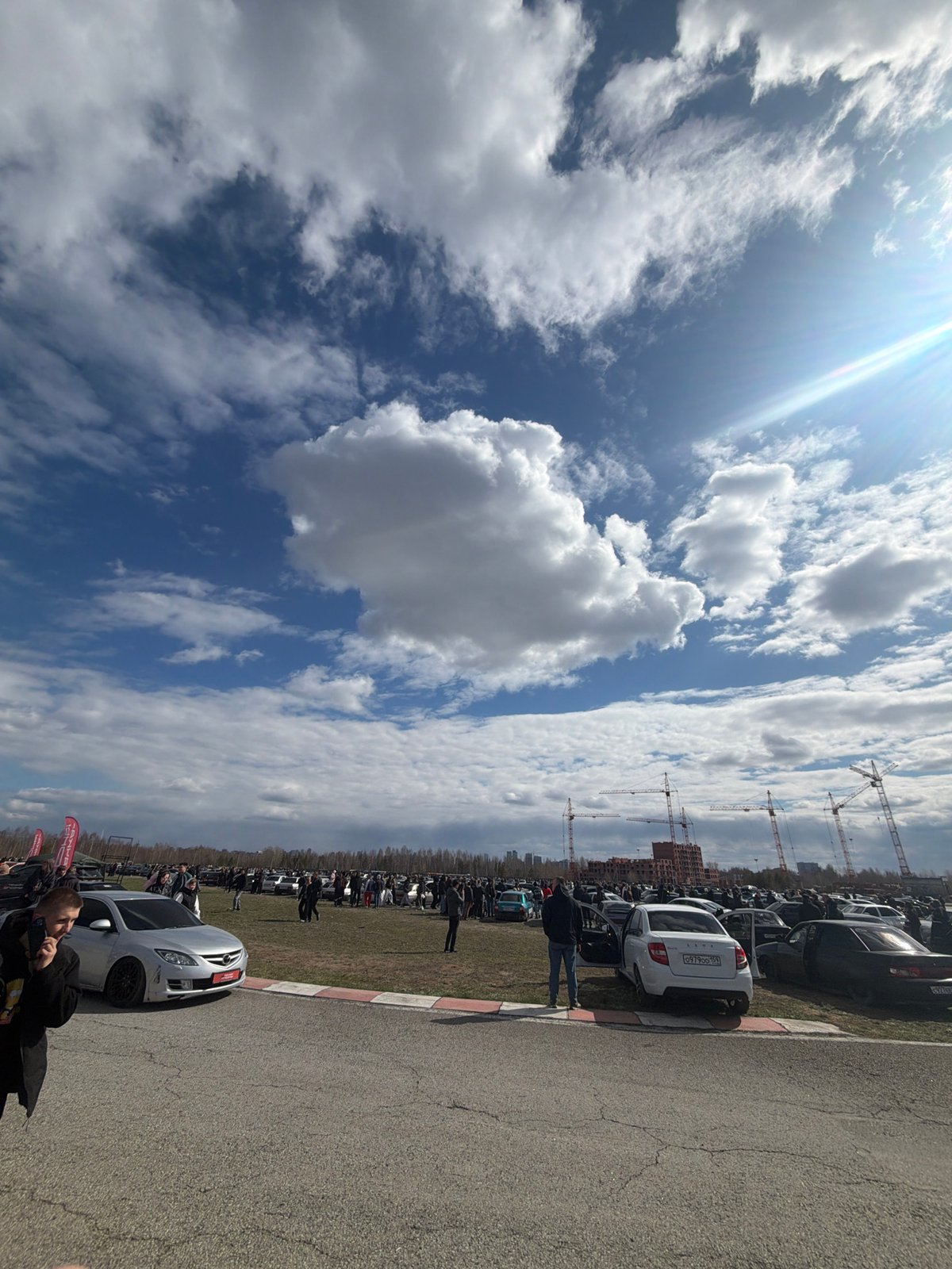 Car gathering draws crowds in Perm, Russia construction zone