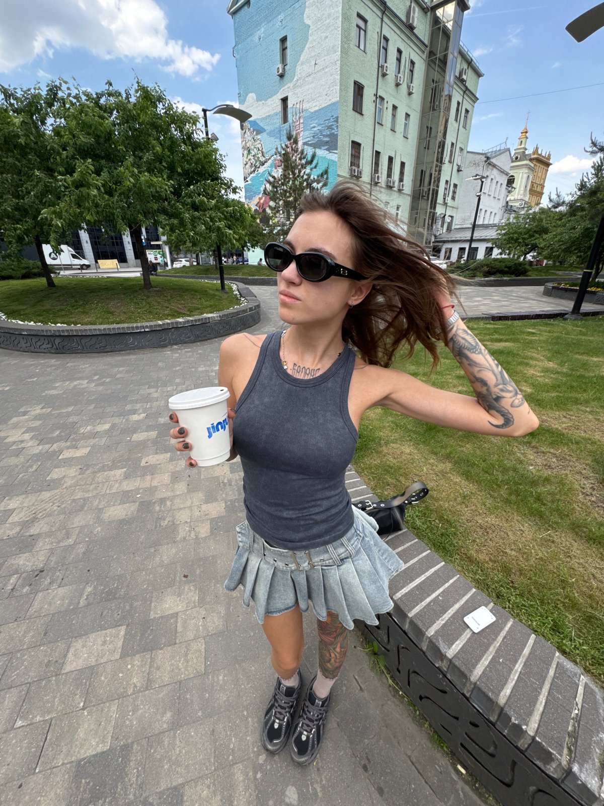 Casual moments captured in Moscow park, beverages shared outdoors
