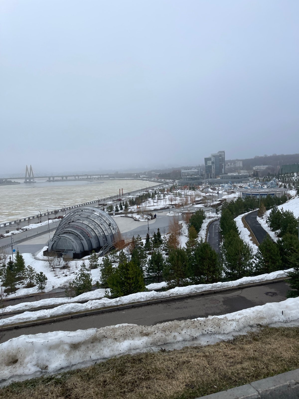 Foggy winter scene documented along frozen Kazanka River in Kazan