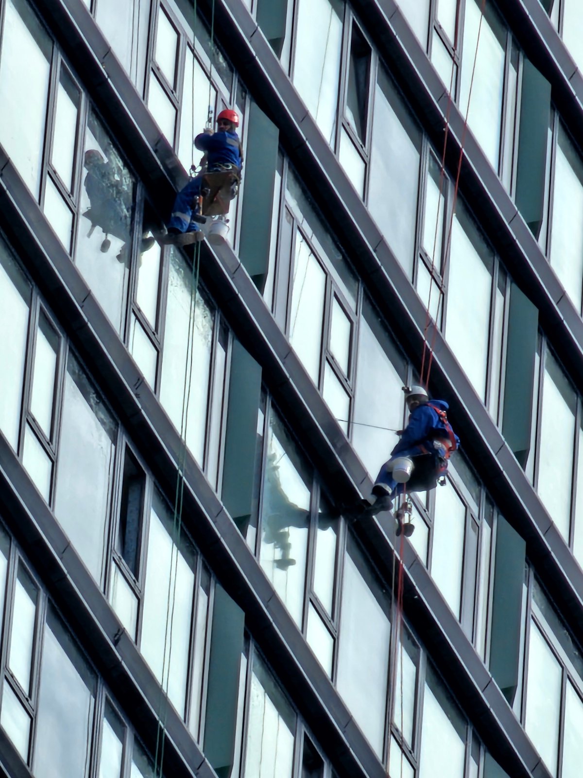 Window washers service modern Moscow building exterior