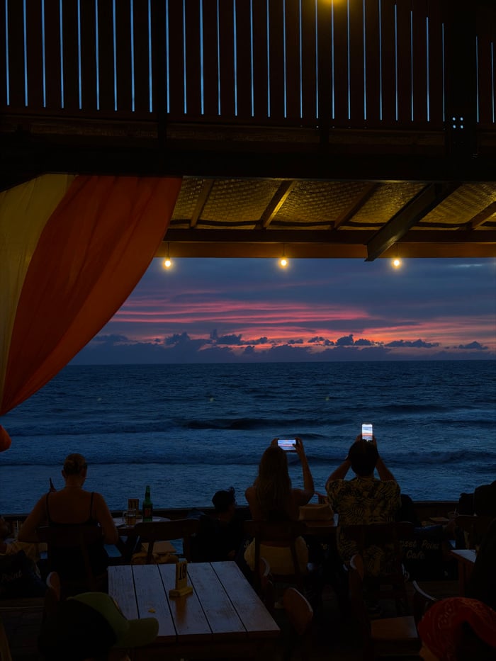 Musical trio performs at Bali beachfront venues during evening