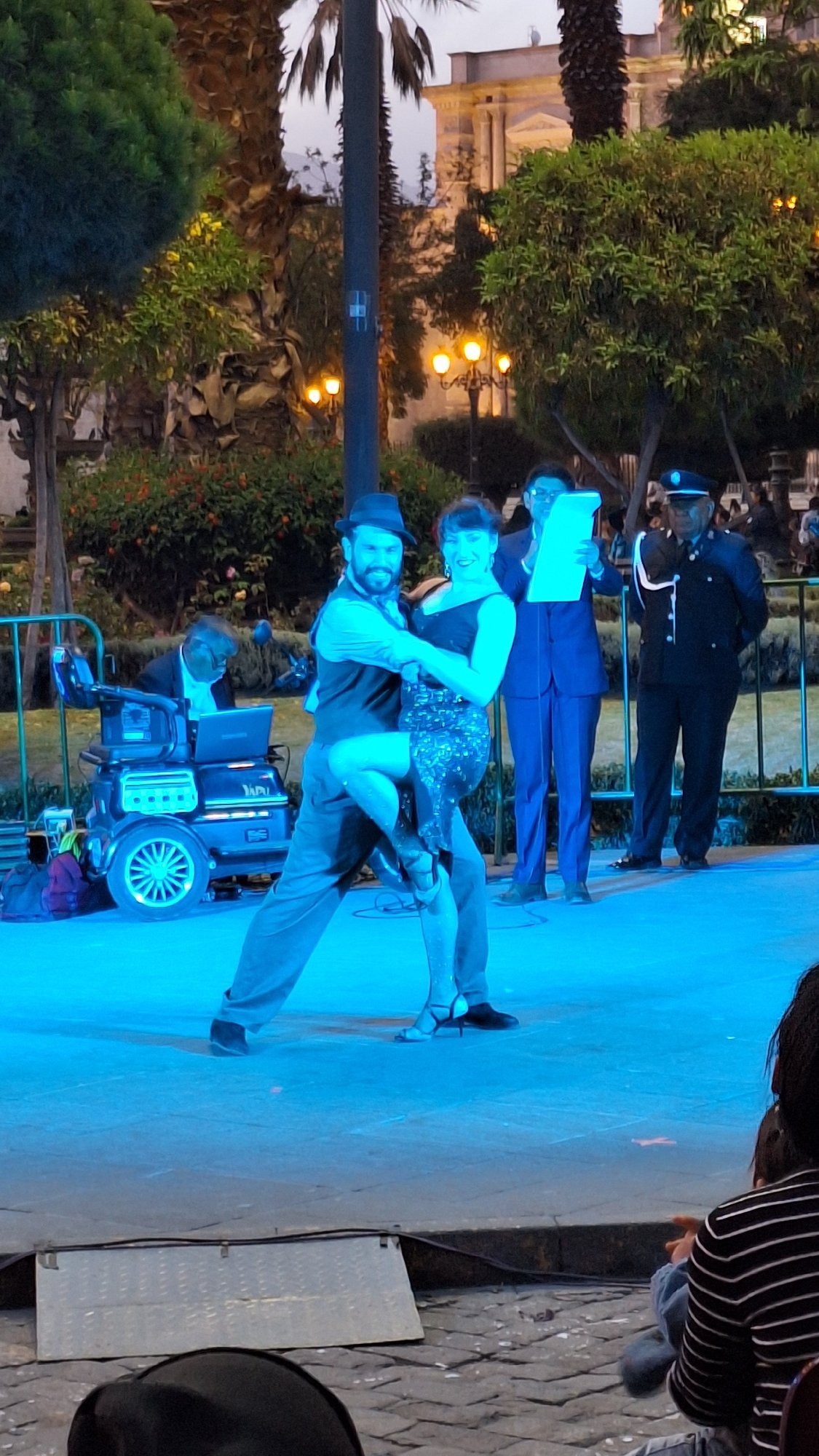 Evening tango performance captured on illuminated stage in Arequipa