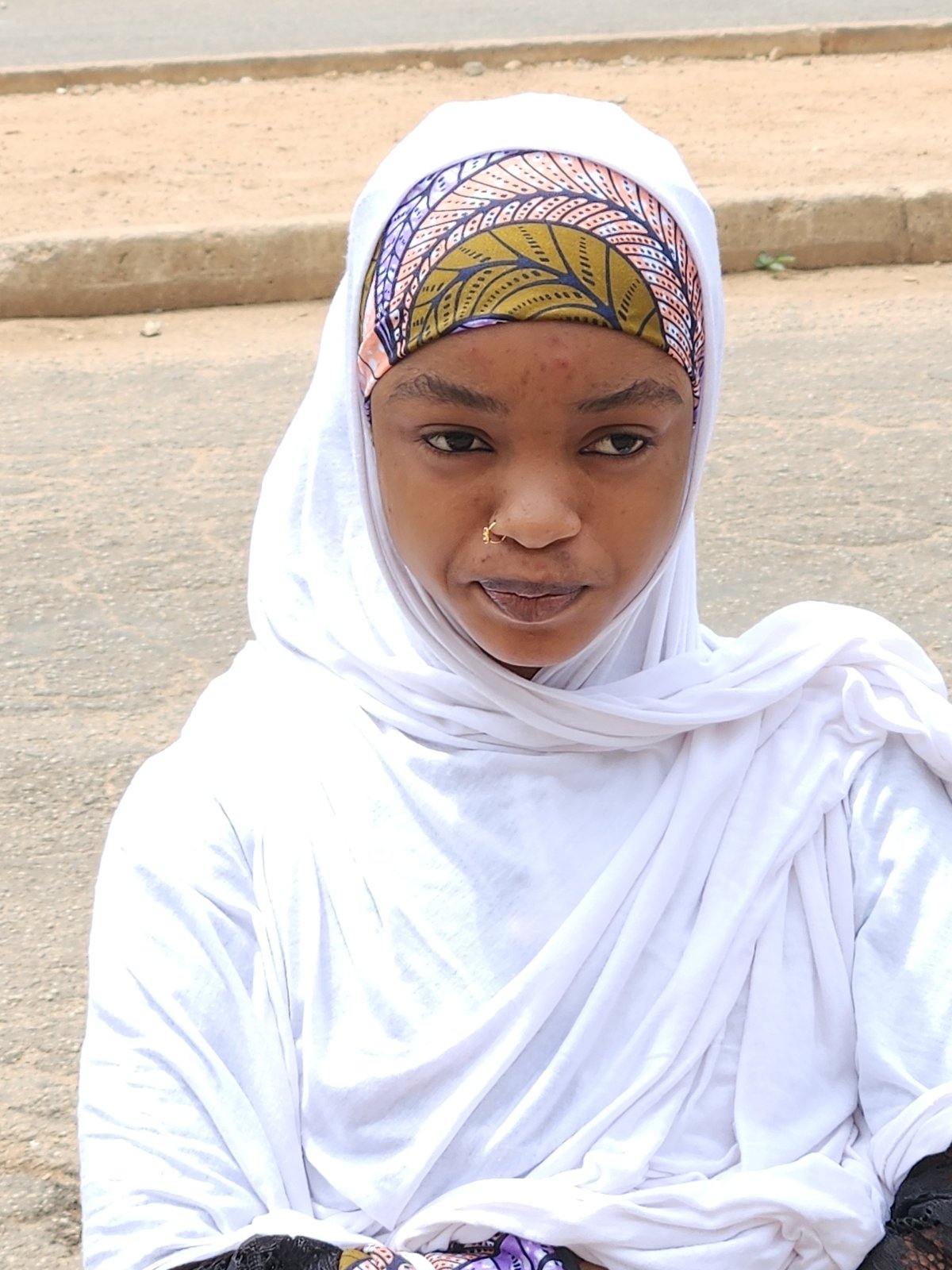 Two portrait-style moments from Jos, Nigeria
