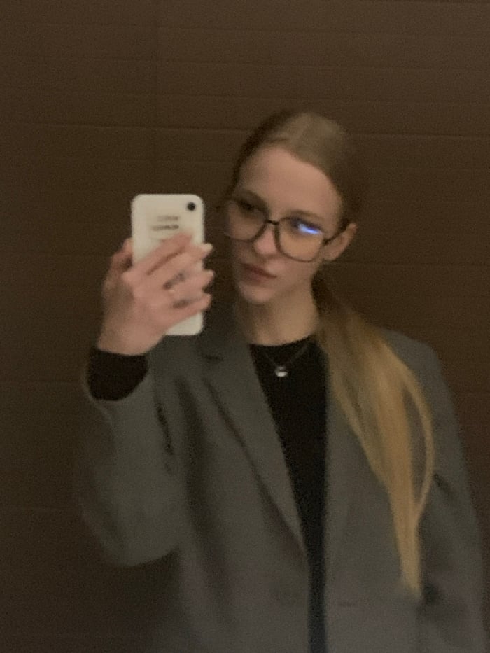 Woman takes multiple selfies in Kyiv mirror session