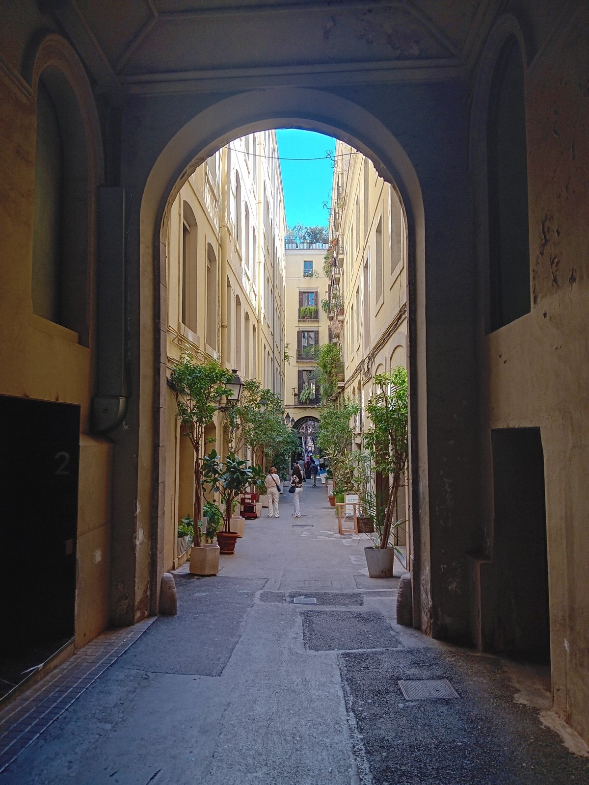 Barcelona archway frames narrow street view