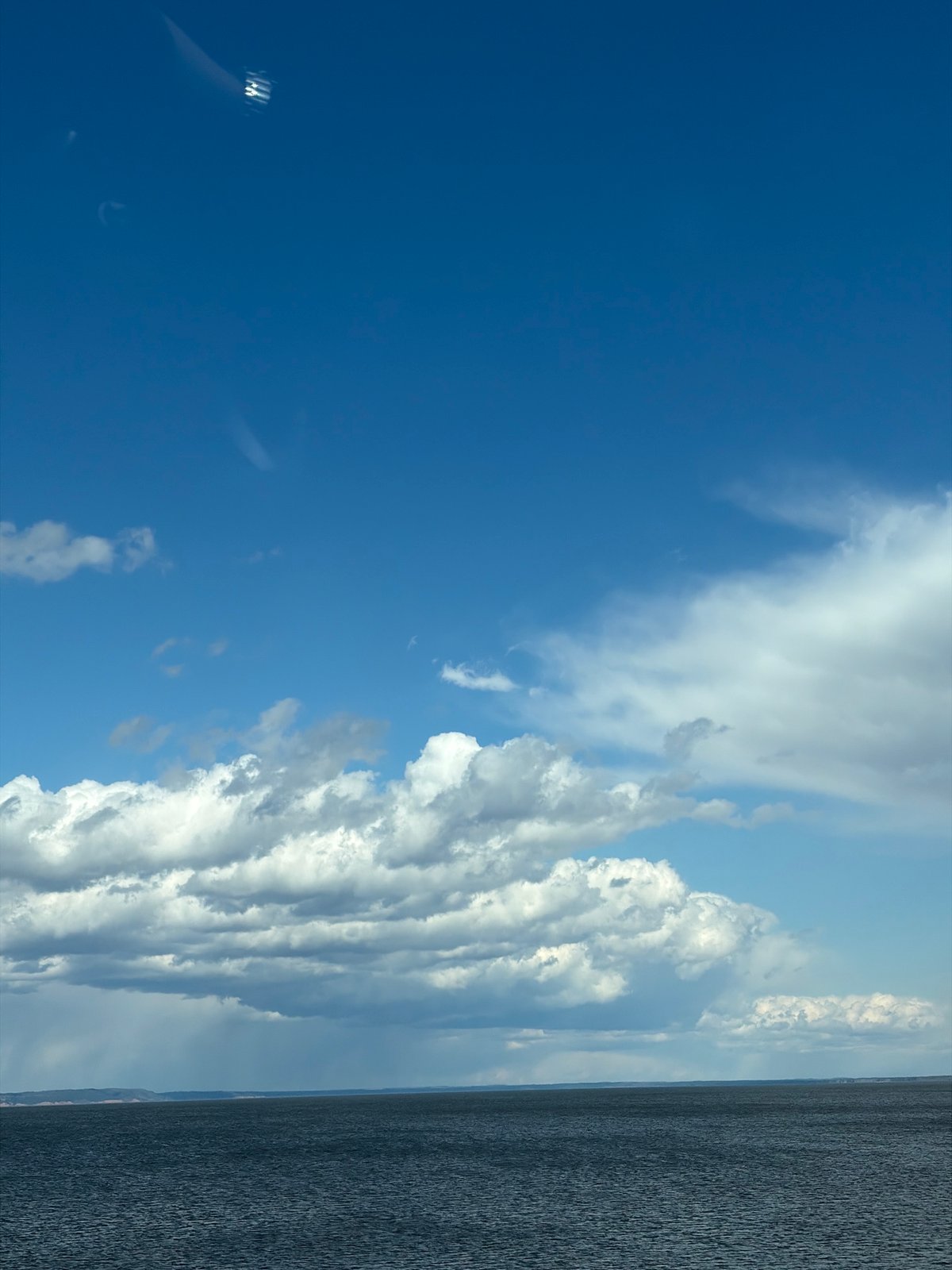 Dramatic sky over water body captured in Chaikovsky, Russia