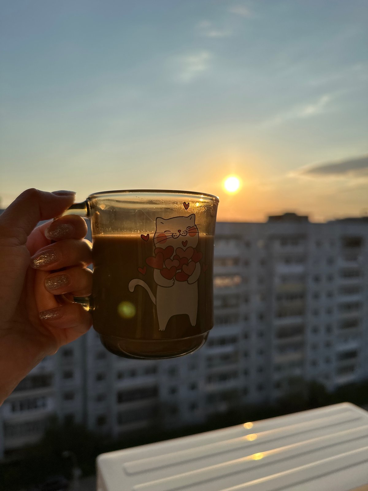 Morning coffee ritual with cat companion documented in Chaikovsky