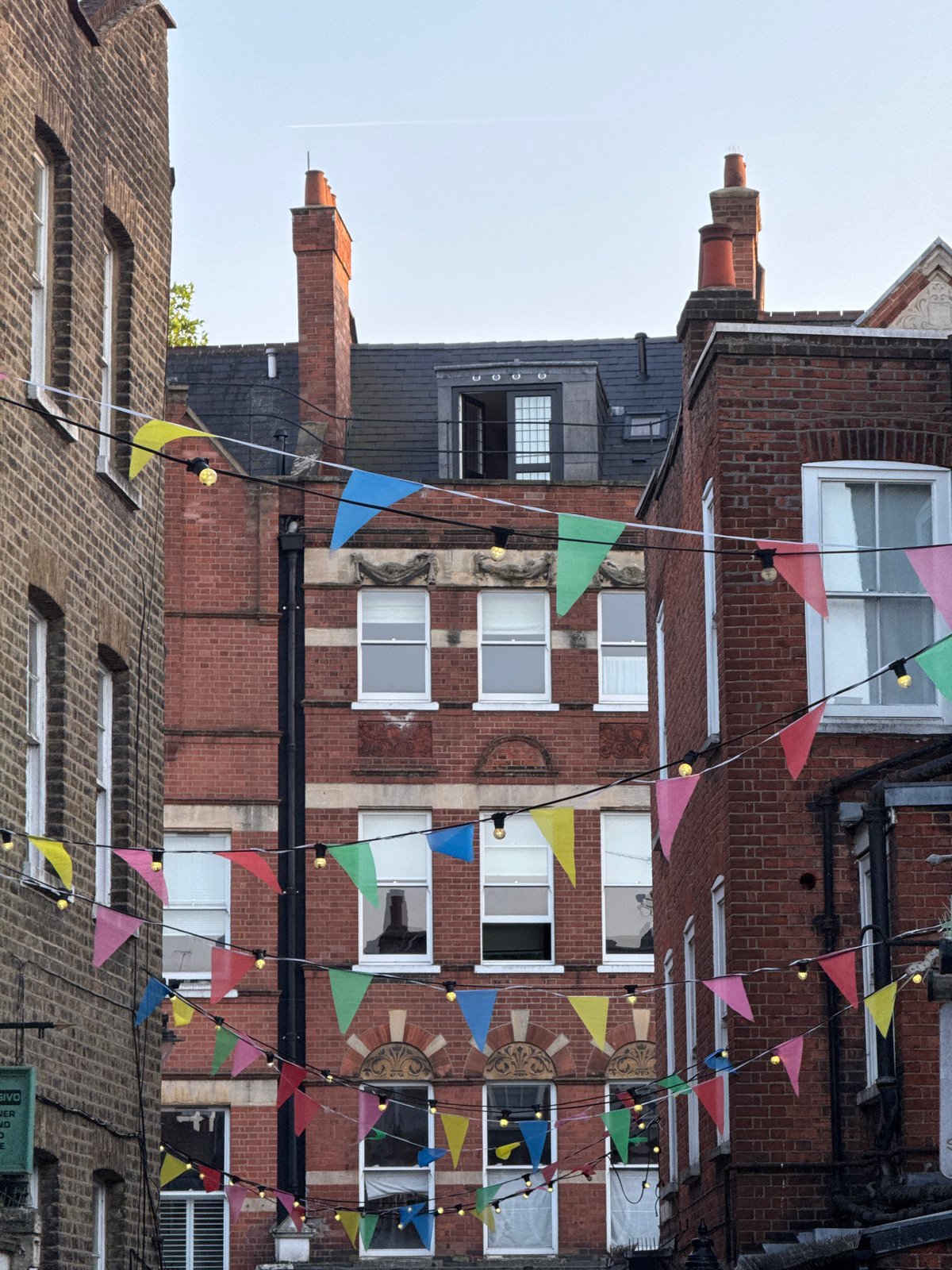 London street hosts casual evening gathering with festive decorations