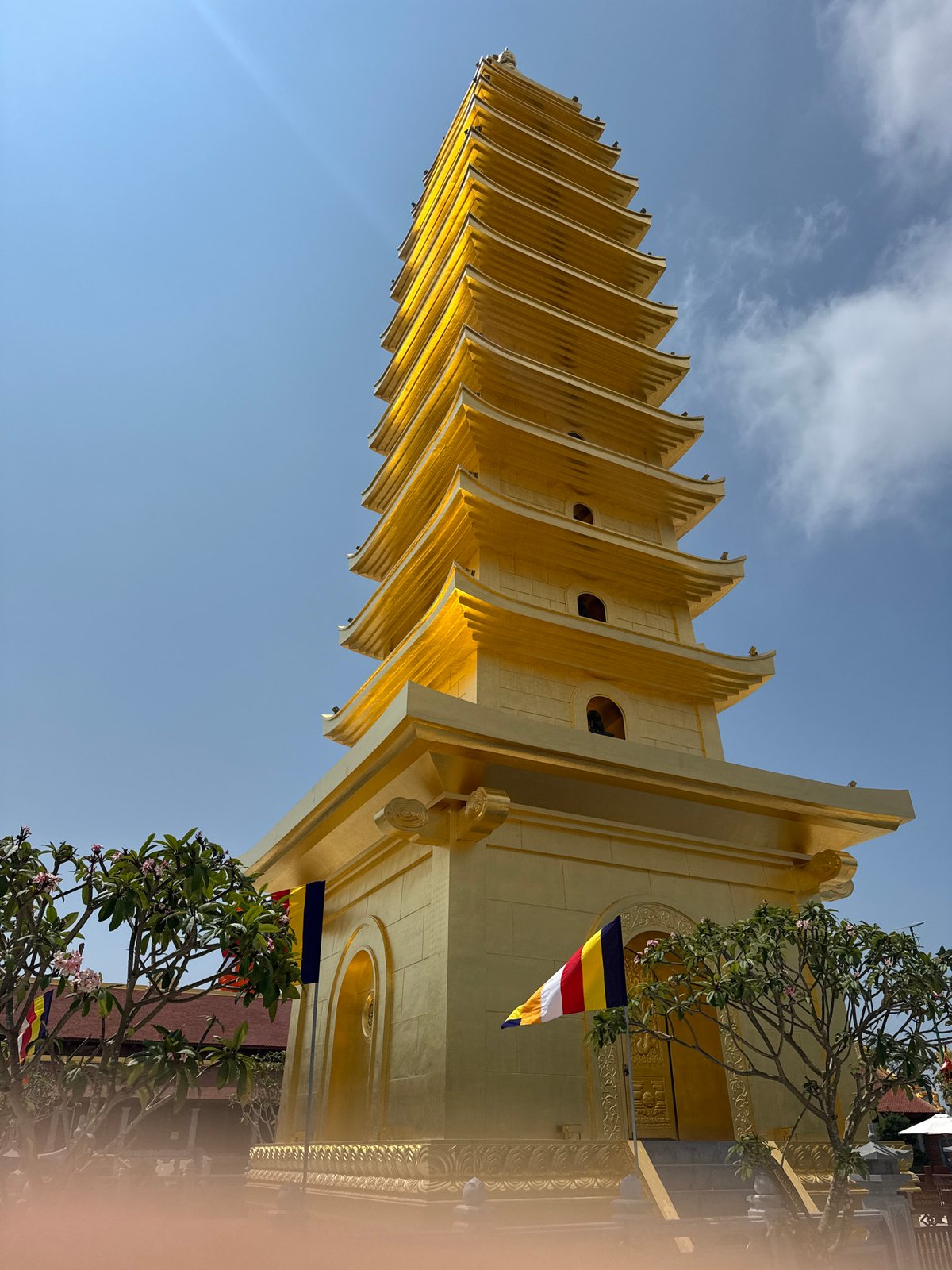 Golden pagoda and temple gate photographed in Diên Khánh