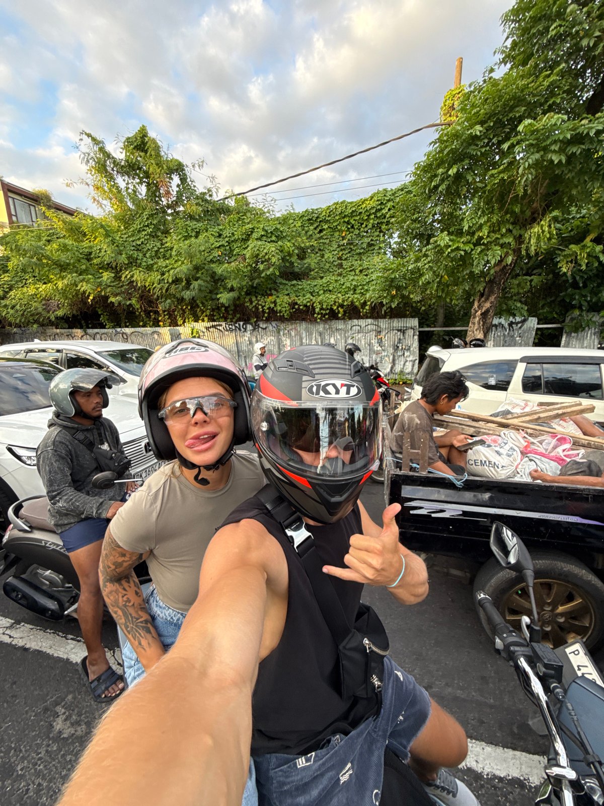 Construction workers take break in truck bed in Kuta