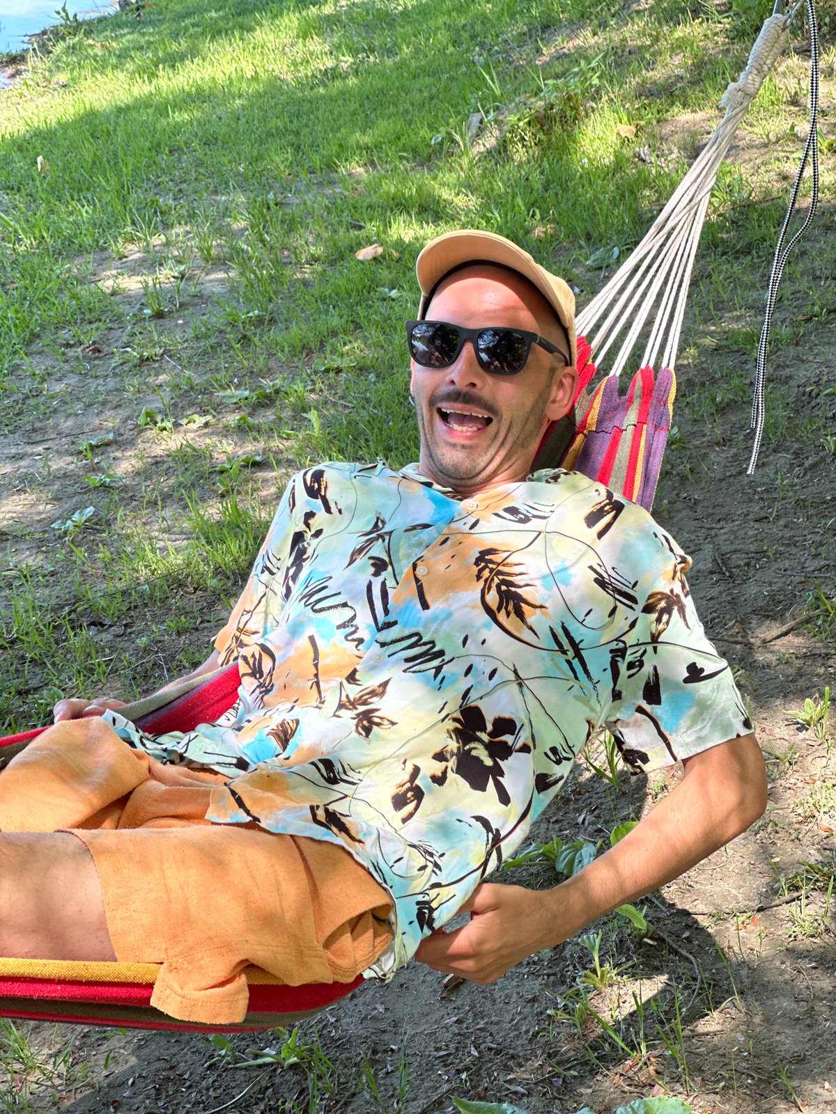 Man enjoys morning leisure time in waterfront Vranjina, Montenegro