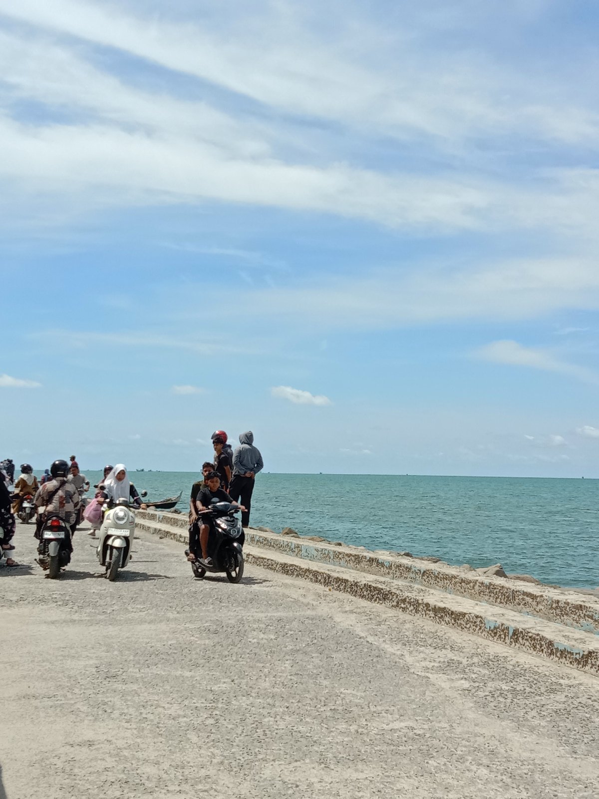 Residential fire draws onlookers in coastal Lhokseumawe, Indonesia