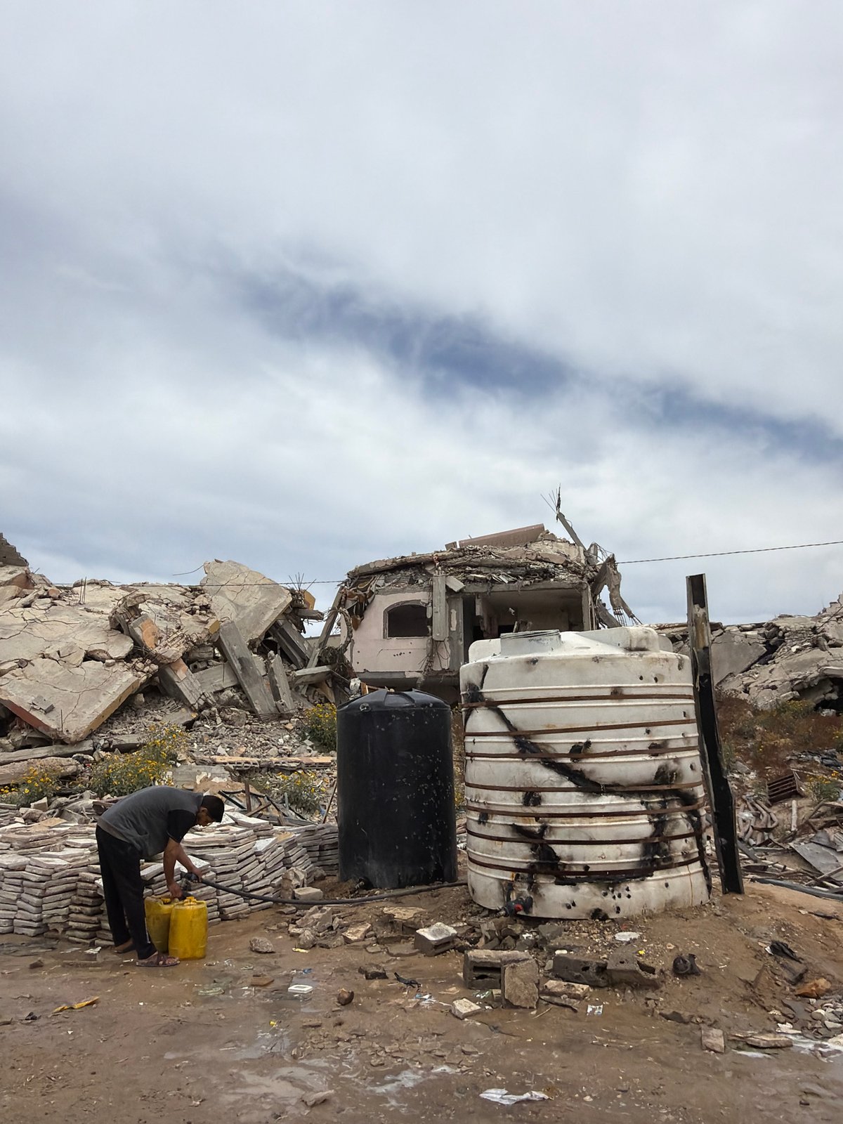 Gaza residents navigate daily life amid destruction, water collection