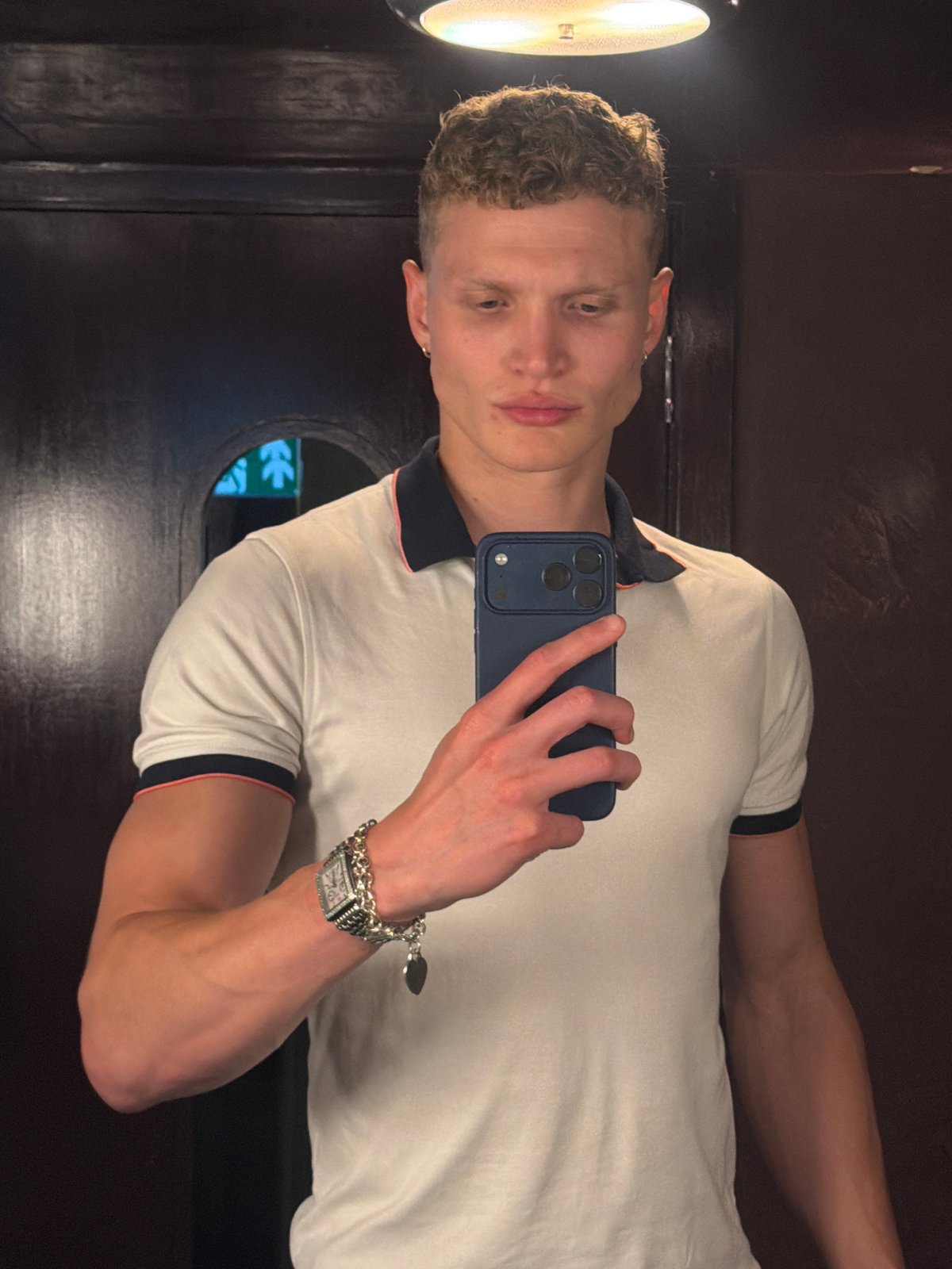 Young man documents evening dining experience at London restaurant