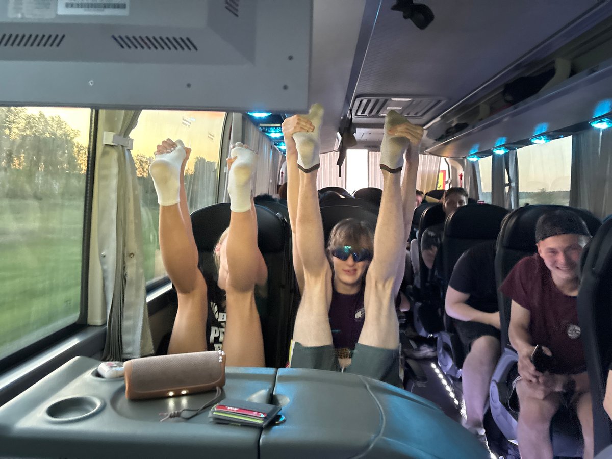 Bus passengers raise legs vertically during transit in Russia