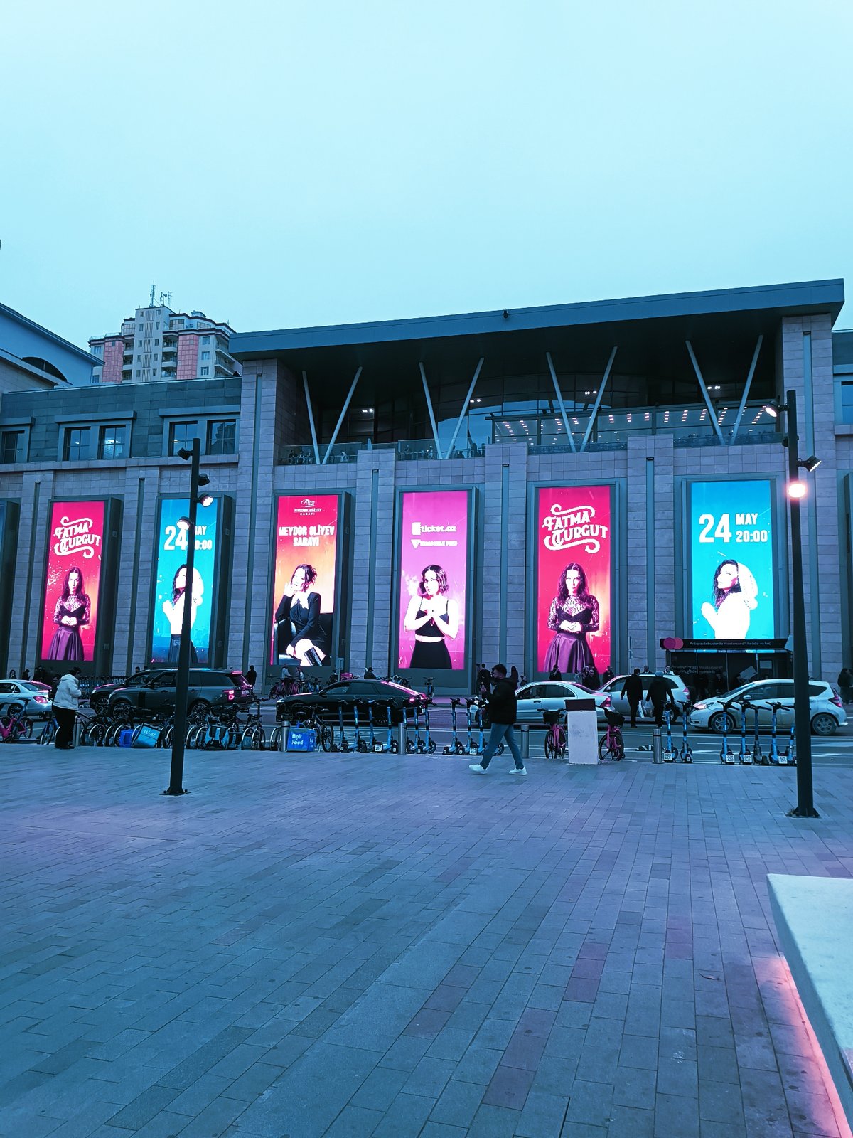 Ordinary street life documented across central Baku plazas