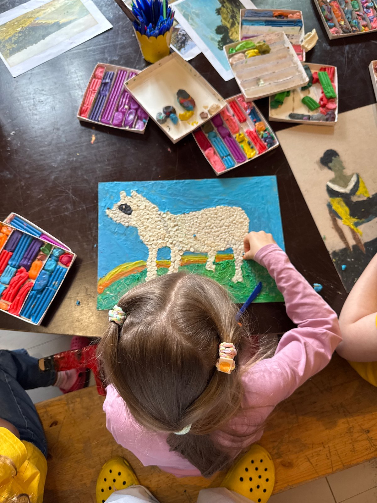 Kids' art workshop in Moscow, clay and painting on the table