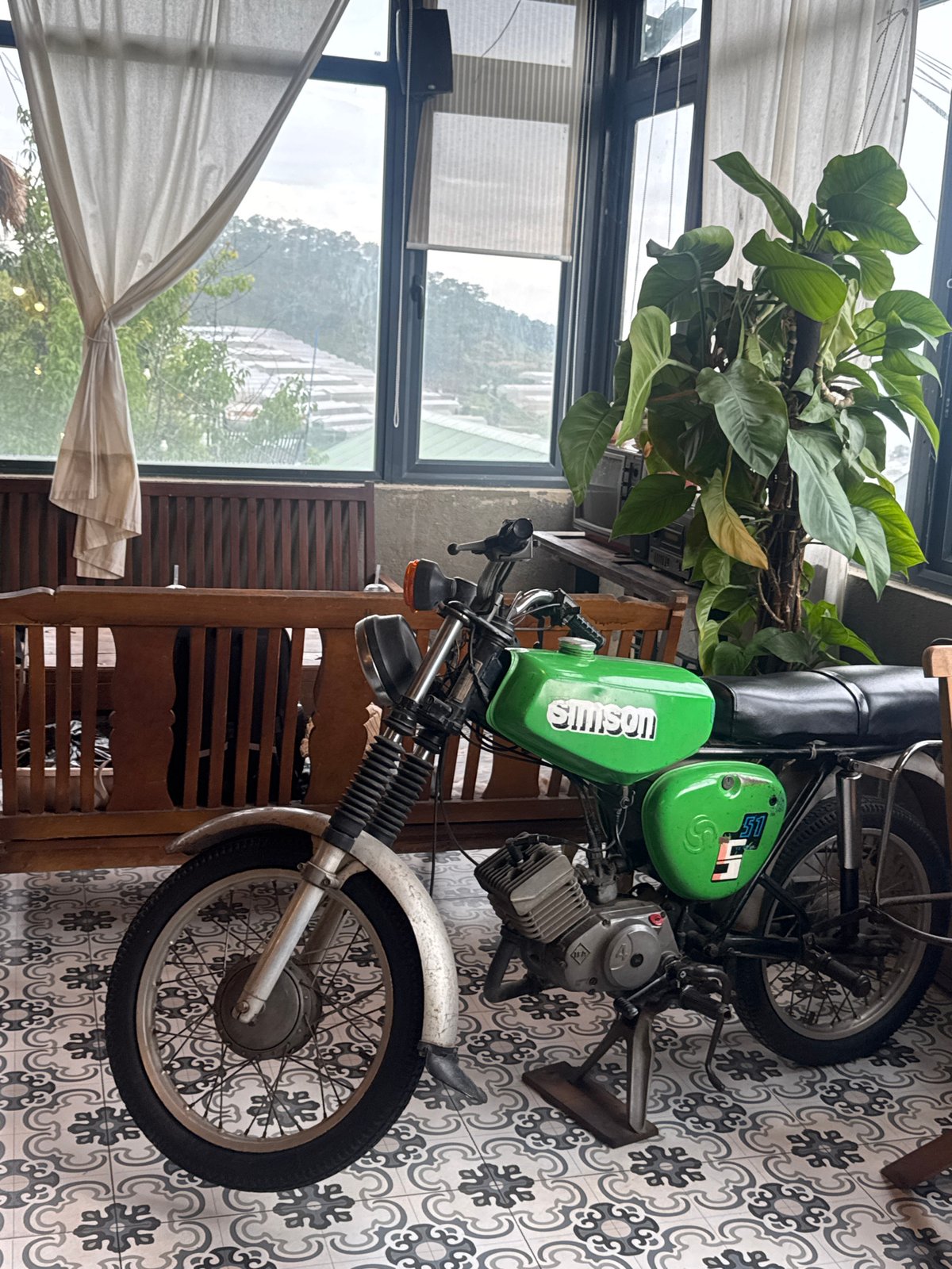 Tourist documents morning garden visit in Vietnamese mountain villages