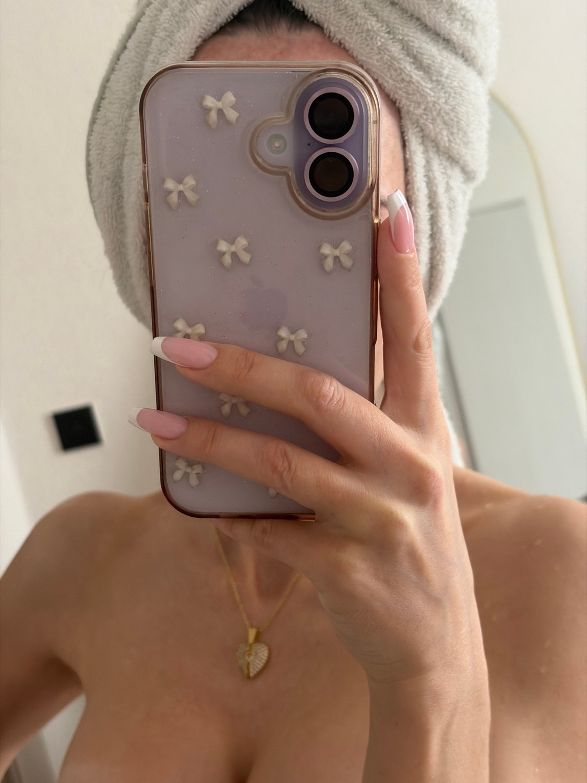 Post-shower mirror selfie captured in Saint Petersburg apartment