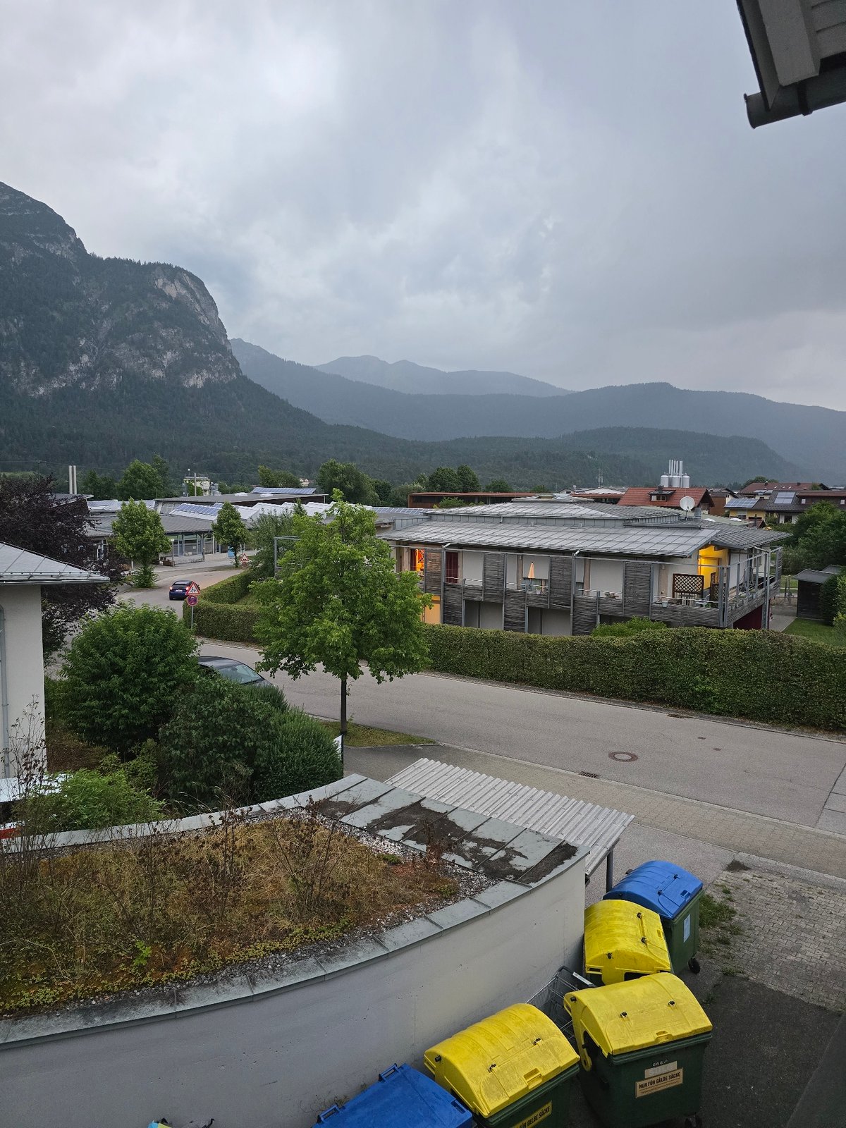 Garmisch-Partenkirchen neighborhood under cloudy Alpine skies