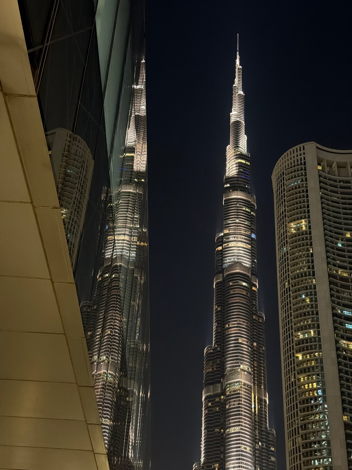 Burj Khalifa reflection captured in Dubai glass surface