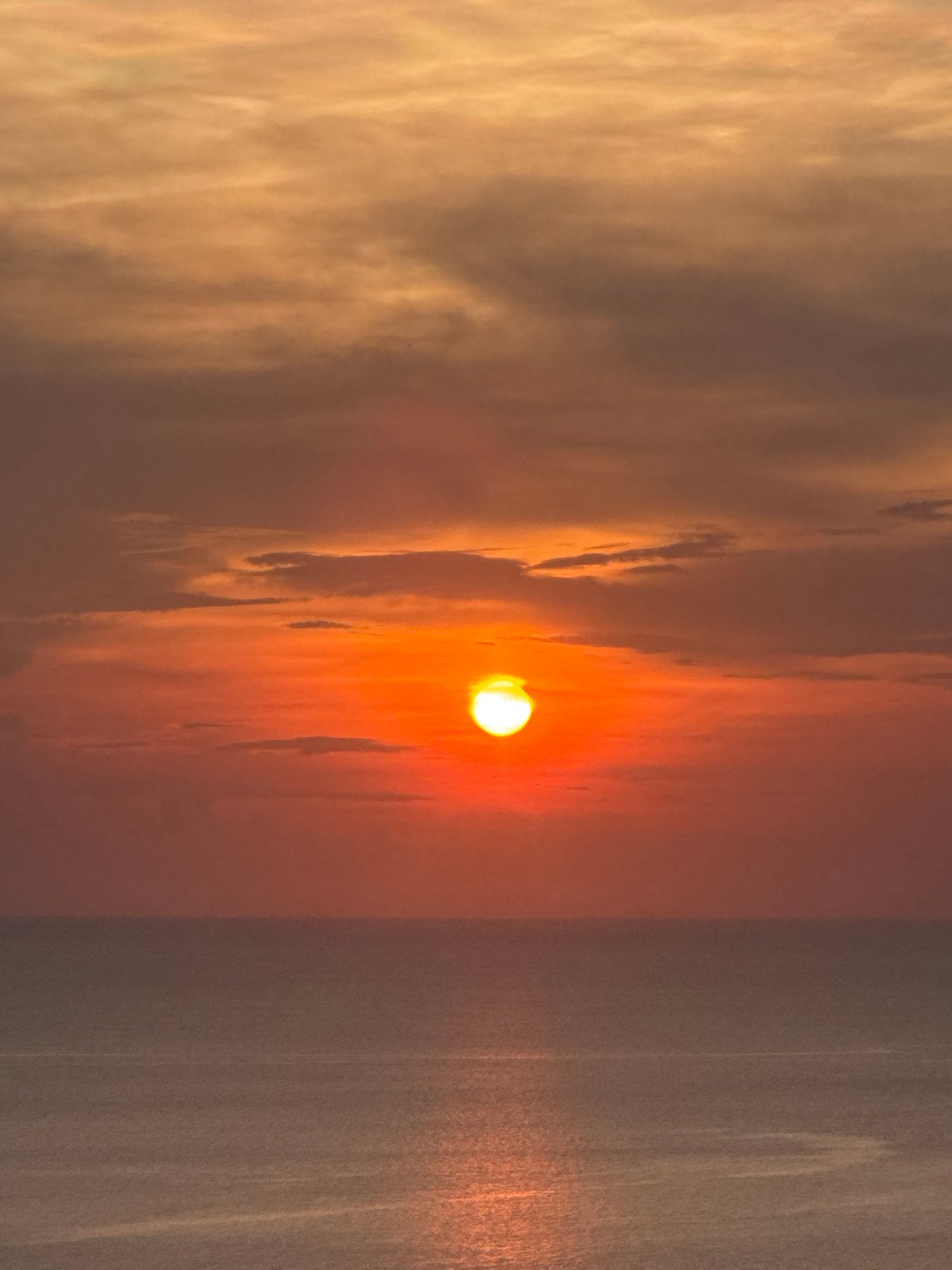 Sunset documented over Andaman Sea near Thai coastal village