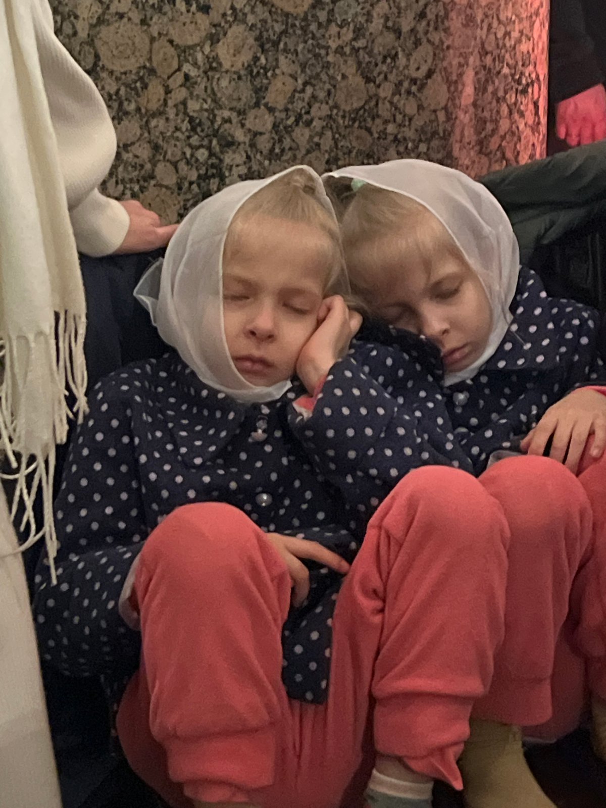 Orthodox clergy process through Saint Petersburg cathedral during evening service