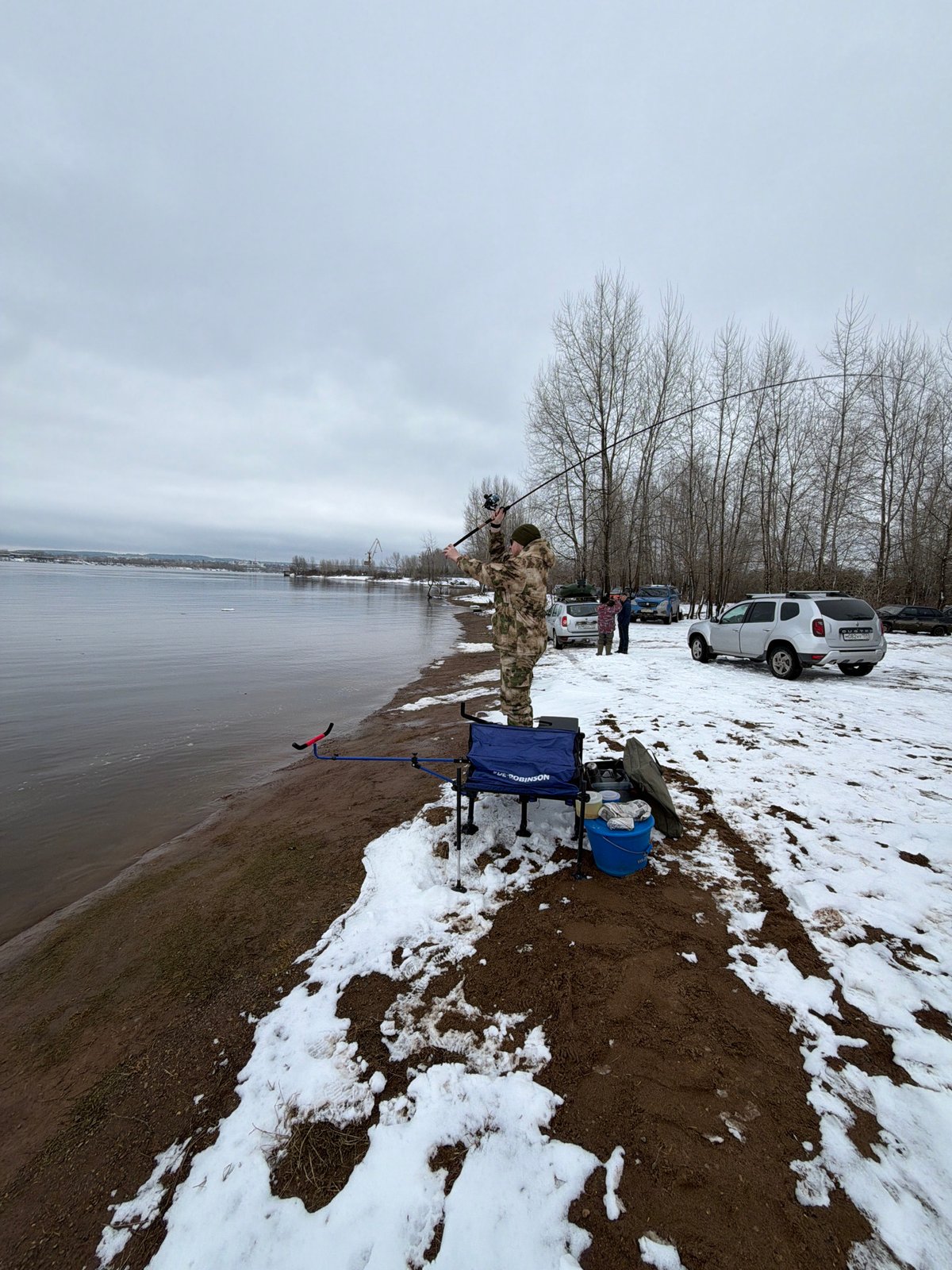 Angler uses bloodworm bait while fishing in Chaikovsky, Russia